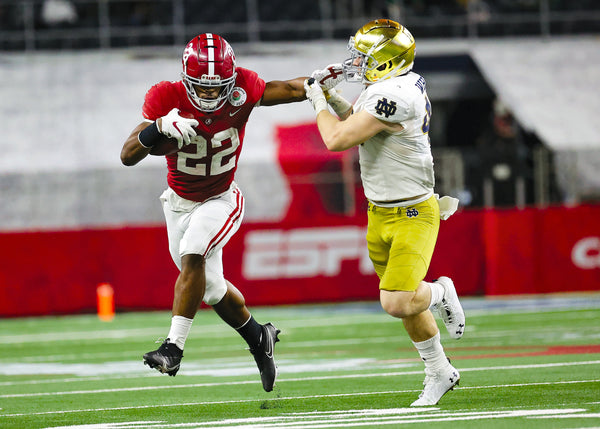 After using his legs to hurdle an Irish defender in the first half, Najee Harris used his arms in the second half to hold one at bay. Because the Tide managed only 55 plays, Harris had just 19 touches — 15 rushes for 125 yards and four catches for 30 yards. Only Notre Dame kept Harris out of the end zone all season. KEVIN JAIRAJ/USA TODAY SPORTS