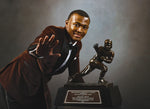 Alabama’s DeVonta Smith, a senior wide receiver from Amite, Louisiana, struck the pose after winning the Heisman Trophy for the 2020 season. He finished comfortably ahead of three quarterbacks: Clemson’s Trevor Lawrence, Alabama’s Mac Jones and Florida’s Kyle Trask. KENT GIDLEY/HEISMAN TROPHY TRUST