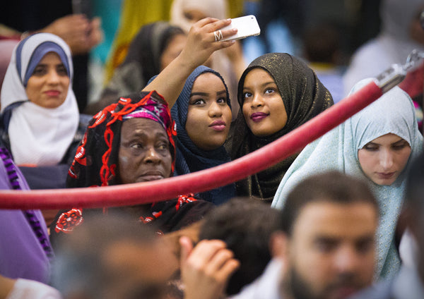 Many worshipers attending Eid ul-Adha, or “festival of the sacrifice,” at the San Diego Convention Center, Sept. 24, 2015, take photos after prayers were completed. The festival marks the end of Hajj, the annual pilgrimage to Mecca in Saudi Arabia by Muslims around the world, and also commemorates the Prophet Abraham's willingness to sacrifice his son Ishmael at God's command. Howard Lipin / The San Diego Union-Tribune