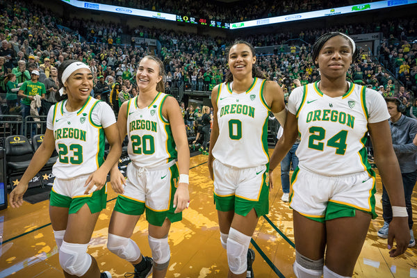 Oregon's Minyon Moore (from left), Sabrina Ionescu, Satou Sabally and Ruthy Hebard celebrate after the No. 3 Oregon Ducks beat the Washington Huskies 92-56 in a women's basketball game on March 1, 2020, at Matthew Knight Arena in Eugene. Courtesy Serena Morones, The Oregonian/OregonLive