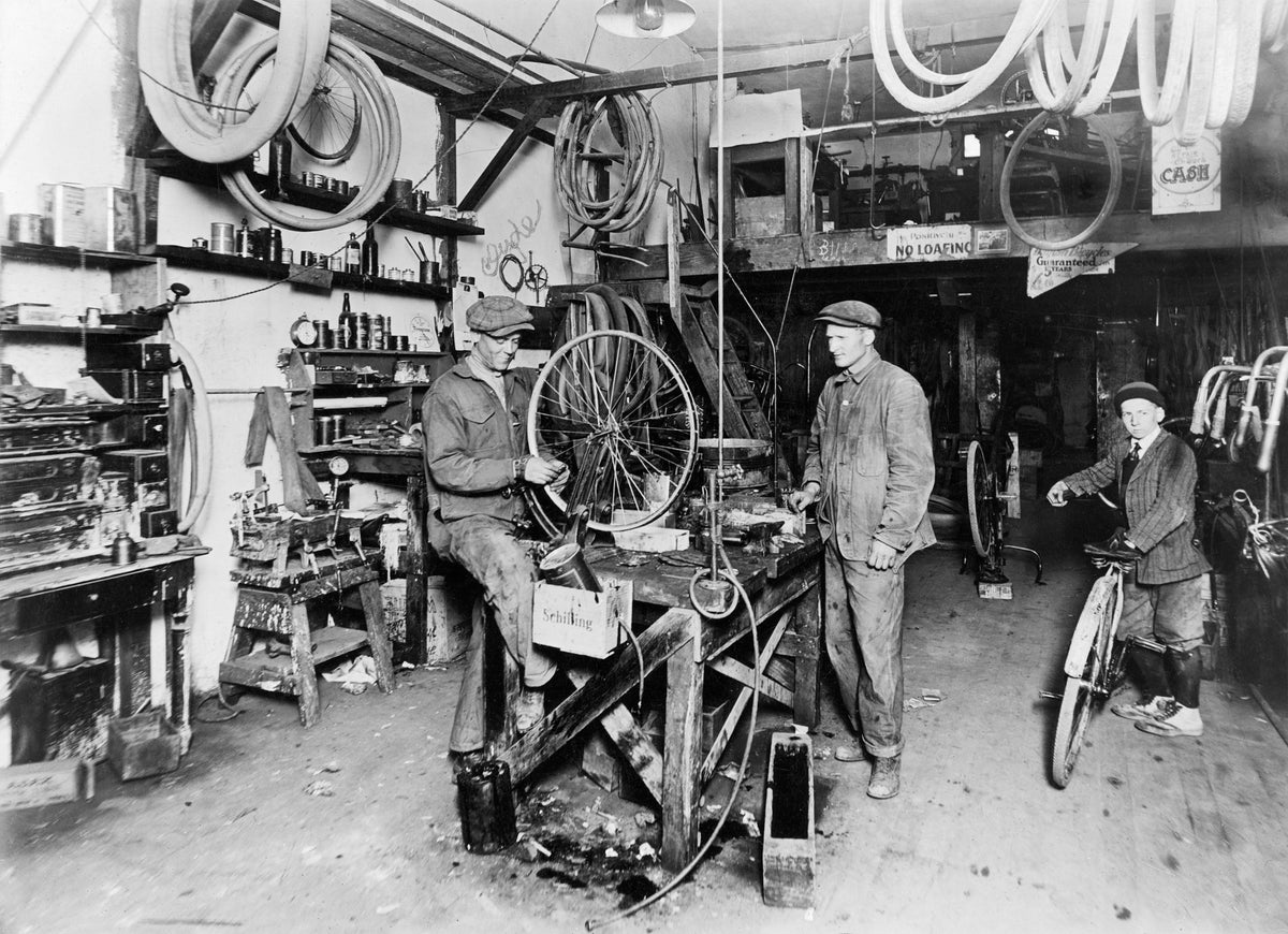 Hartman Long Bike and Key Shop on southeast Court Street, second block from Main Street, Athena, 1916. From left: Clyde Perkins, Dean Long, unidentified. Courtesy Mark Perkins