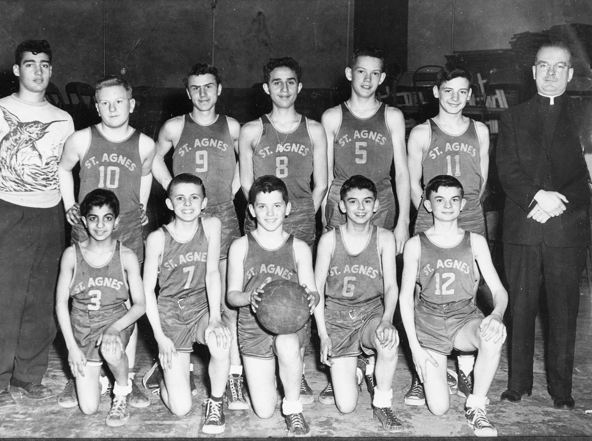 St. Agnes basketball team, Utica, 1951. Front row, left to right: Albert Mazaloom, Paul Lange, Terry Murphy, Bill Chambrone and Tom Mahar. Back row, Coso Sarasino (coach), Bill Walsh, Eddie Masohn, Anthony Tresoline, Terry Green, Dan Salvo and Rev. Guyder.