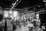 Raleigh Iron Works employees working on the forming process for artillery shells for the US Army and Navy during World War I, circa 1917. Courtesy State Archives of North Carolina / #WWI 4.B1.F36.2