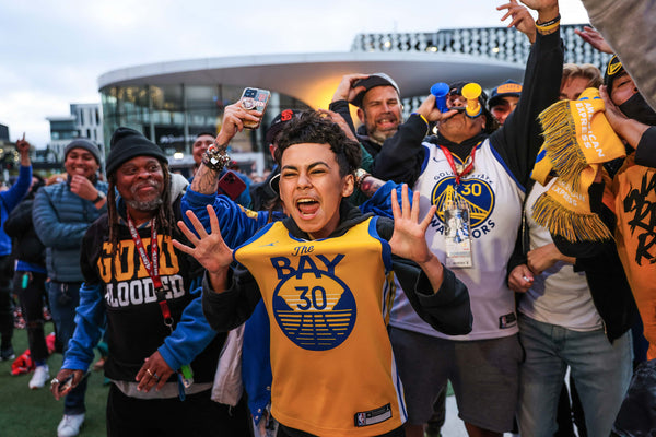 Fans react with joy after the Golden State Warriors defeated the Dallas Mavericks in Game 5 of the Western Conference Finals outside Chase Stadium on Thursday, May 26, 2022 in San Francisco, California. The Warriors defeated the Mavericks 120-110. Gabrielle Lurie / The Chronicle