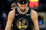 Klay Thompson (11) walks back up court as the Golden State Warriors played the Dallas Mavericks at Chase Center in San Francisco, Calif., on Tuesday, January 25, 2022. Carlos Avila Gonzalez / The Chronicle