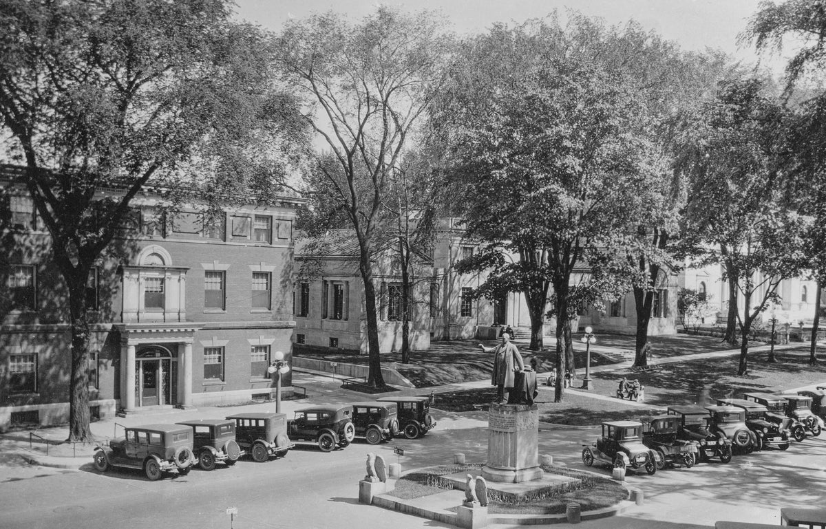 Cars parked in front of the Roswell P. Flower Memorial Library at 229 Washington Street, circa 1920. The library was built in 1903 and added to the National Register of Historic Places in 1980. Courtesy Jefferson County Historical Society / #76.52.102