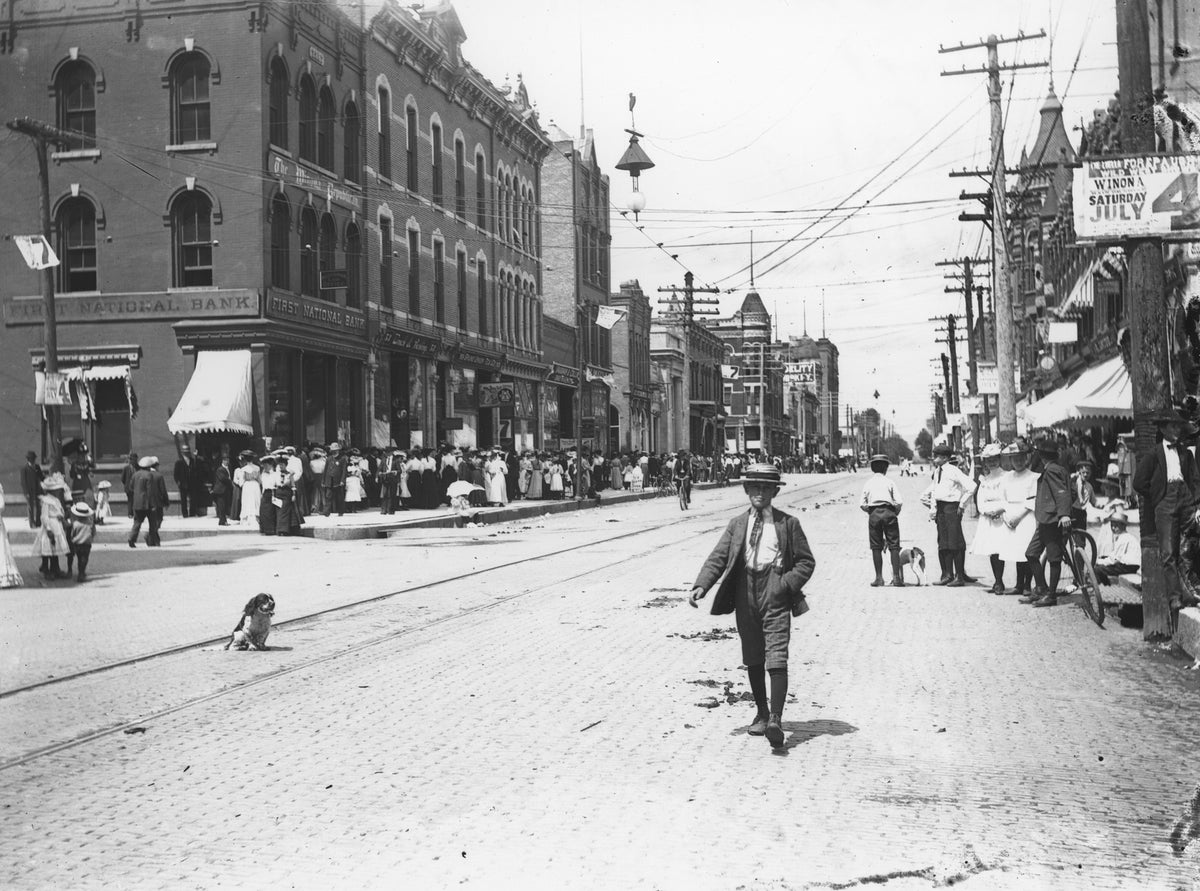 A crowd lining up on Third Street (looking west) in anticipation of a Fourth of July parade, circa 1905. Courtesy Winona County Historical Society
