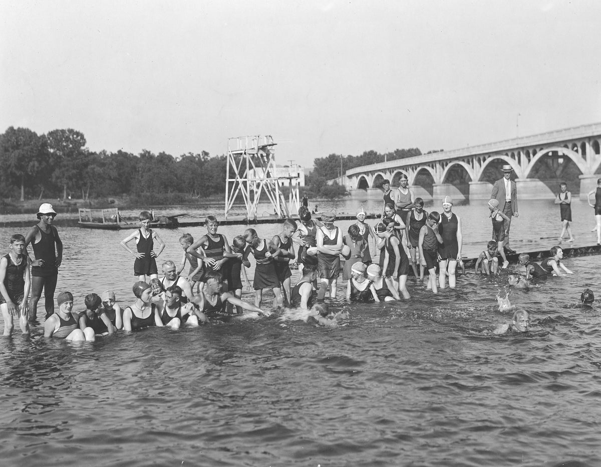 Latsch Public Baths, north channel, circa 1922. Locker keys are hanging around the necks of the bathers. Courtesy Winona County Historical Society