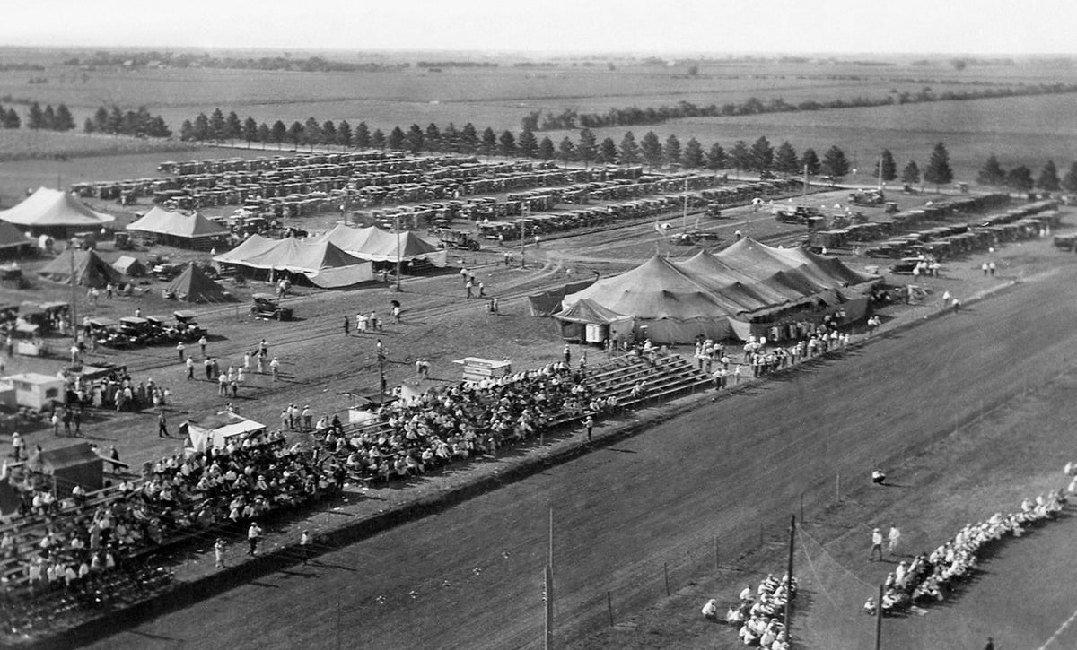 Circa 1920, a half-block of ground between Fifth and Sixth streets on Platte Avenue was acquired for fair purposes. The quarters became inadequate so fairs were held in tents at various locations until 1948 when the present land at the north side of the city was acquired and a permanent fair was established there. This photograph shows only a partial view of the fair at that time.