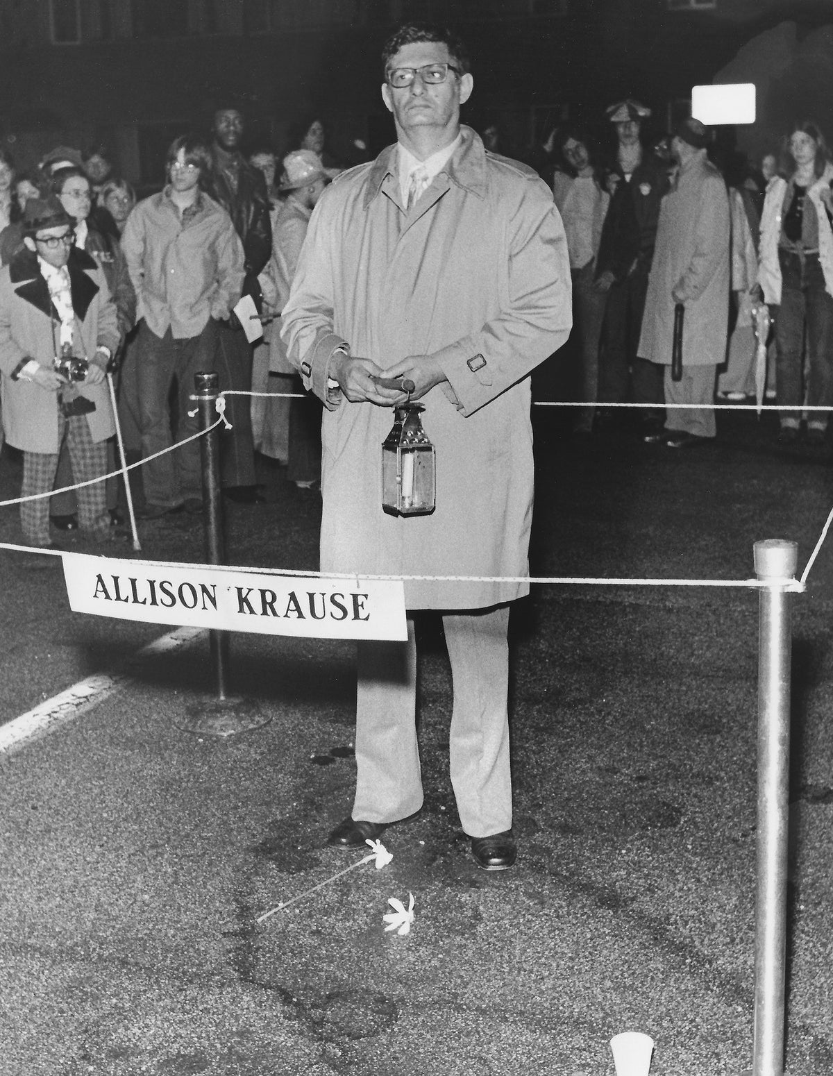 Arthur Krause, father of Allison Krause, stands on the site in the parking lot of Prentice Hall where his daughter was shot by National Guardsmen on May 4, 1970, on the Kent State University campus. Krause was part of the candlelight vigil and march to commemorate the anniversary of the shootings in 1975, May 3, 1975. Courtesy Akron Beacon Journal.