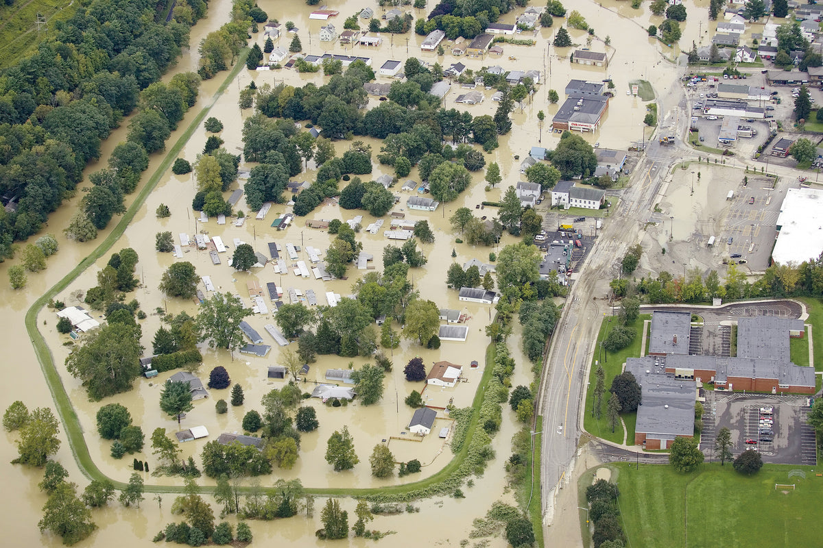 Flooding covers West Corners early Thursday afternoon near Linneaus W. West Elementary School, lower right, in the Town of Union. The intersection of Day Hollow Road and New York State Route 26 is at the top right. SIMON WHEELER / STAFF PHOTO