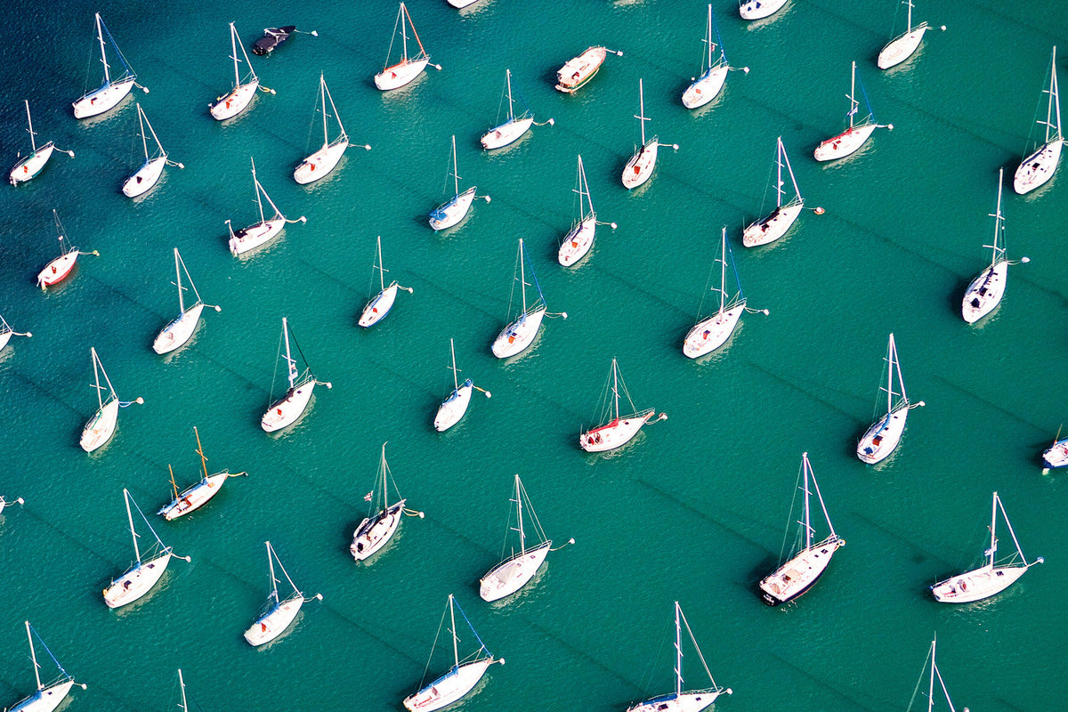 While on a photo shoot in a helicopter, we flew over Burnham Harbor in Chicago. I saw the patterns and colors of the boats below and made an exposure. John Caruso