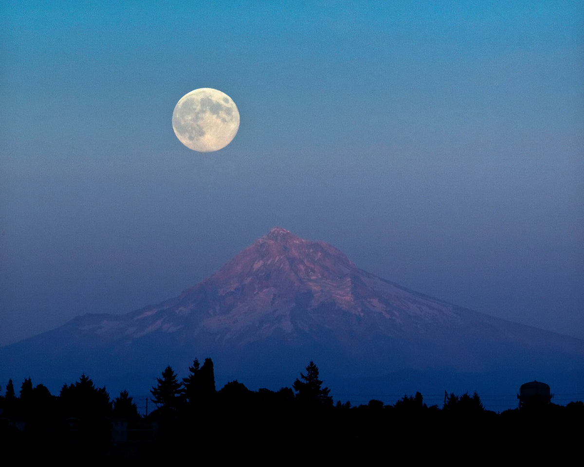 A full 'blue' moon rises over Mt. Hood on Tuesday night in Portland, Aug. 20, 2013. The moon is the third moon of four in the summer season, better known as a blue moon to scientists. Courtesy Mike Zacchino/The Oregonian