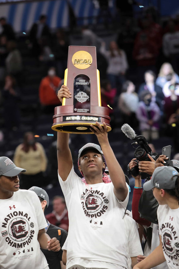 South Carolina’s Aliyah Boston (4) holds up the national championship trophy after winning the national championship game against UConn at the Target Center in Minneapolis on April 3, 2022. Tracy Glantz / The State