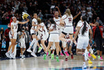 The University of South Carolina Gamecocks celebrate winning the national championship game against UConn, April 3, 2022. Tracy Glantz / The State