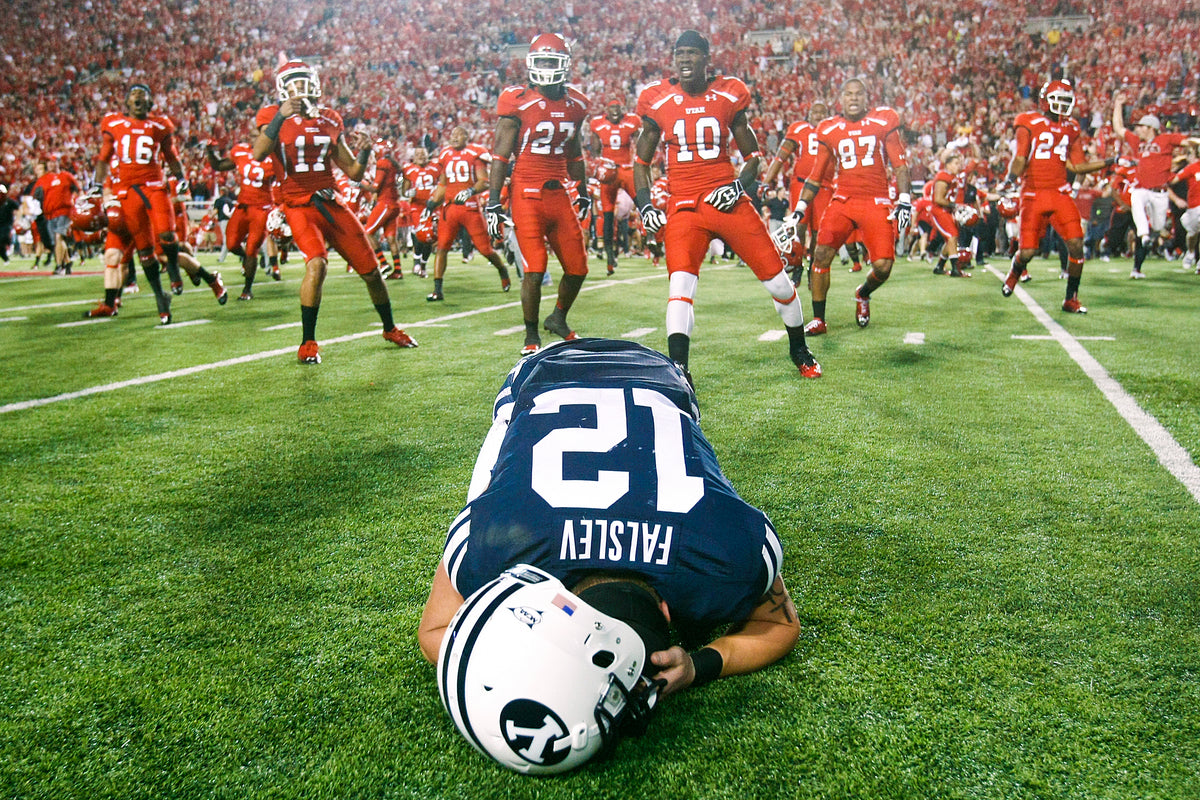 Brigham Young University wide receiver JD Falslev collapses after the team misses a last-second field goal against the University of Utah in September 2012. Chris Detrick / The Salt Lake Tribune