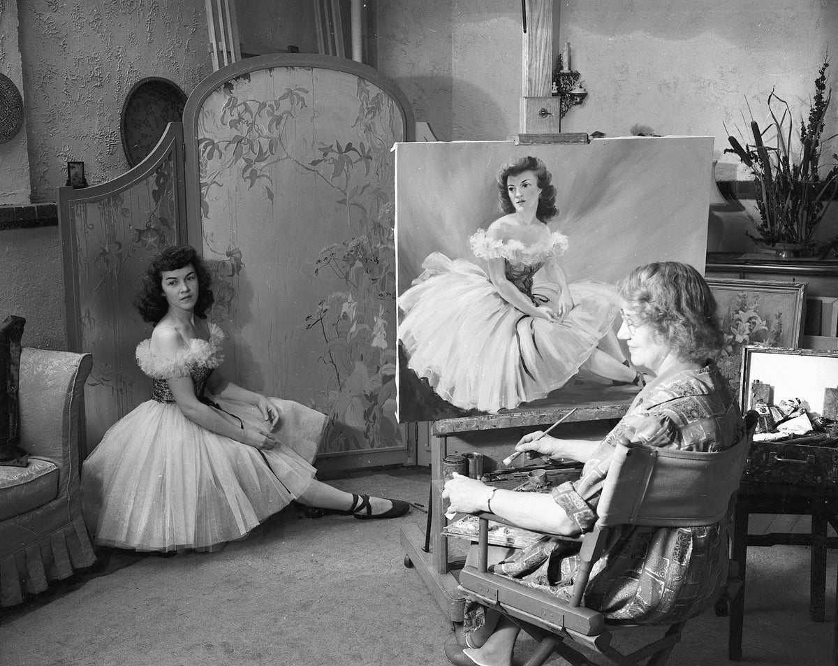 Salt Lake City artist Florence Ware paints a model for a Christmas card at her home studio in 1945. Utah State Historical Society