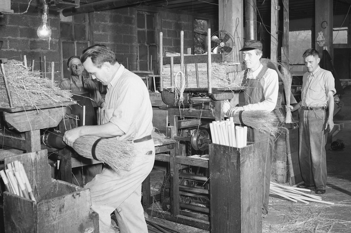 Workers at the Joplin Association for the Blind assemble brooms at their workshop at 2201 Empire. Brooms manufactured at the workshop were sold at wholesale cost in 83 countries. The Joplin Association for the Blind was one of eight other organizations supported by the Community Chest. The Community Chest would later merge into the United Way. 1941