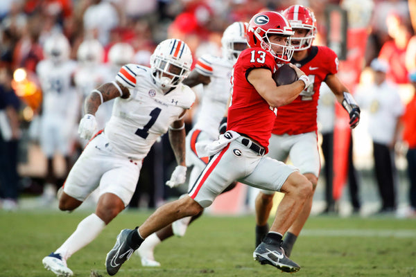 Georgia Bulldogs quarterback Stetson Bennett (13) breaks away for a long touchdown run during the second half of a game between Auburn and Georgia in Athens, Ga., Sept. 8, 2022. Joshua L. Jones / Athens Banner-Herald