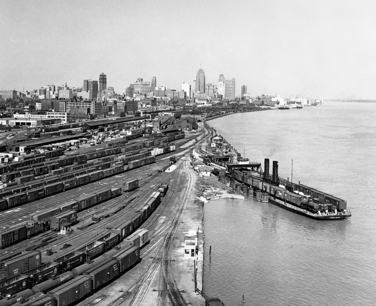 Wabash Railway’s railyard along the western riverfront, taken from the Ambassador Bridge, circa 1952. Wabash Railway’s car ferry Detroit of Detroit is docked on the right. In the background are the adjacent railyards of Chesapeake & Ohio Railway and New York Central System. The downtown skyline is visible further in the distance, where the City-County Building can be seen under construction.Courtesy Detroit Historical Society / #2009.019.253