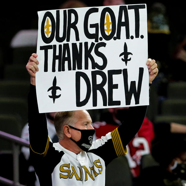 Larry Rolling pays homage to Drew Brees in what would be his final game as a Saint on Jan. 17, 2021. David Grunfeld / The Times-Picayune | The Advocate