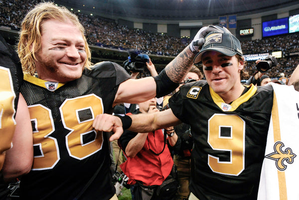Tight end Jeremy Shockey celebrates a playoff win with quarterback Drew Brees after the game in the Superdome against the Minnesota Vikings on Jan. 24, 2010. Bill Feig / The Times-Picayune | The Advocate