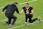 Brees and Payton shake hands before the Saints host the Chicago Bears in an NFC wild card football game in New Orleans on Jan. 10, 2021. David Grunfeld / The Times-Picayune | The Advocate