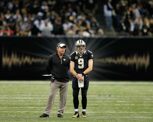 New Orleans Saints quarterback Drew Brees (9) and New Orleans Saints head coach Sean Payton chat during a timeout during a game against the Tampa Bay Buccaneers at the Superdome in New Orleans, December 29, 2013. David Grunfeld / The Times-Picayune