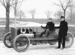 Henry Ford (right) and driver Barney Oldfield pose with the 999, an early race car developed by Ford and his team, in 1901. Photo taken by C.R. Brooks. Courtesy The Detroit News