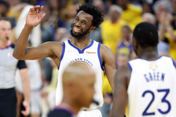 Golden State Warriors’ Andrew Wiggins smiles at Draymond Green during 2nd quarter of Warriors’ 104-94 win over Boston Celtics in Game 5 of NBA Finals at Chase Center in San Francisco, Calif., on Monday, June 13, 2022. Scott Strazzante / The Chronicle