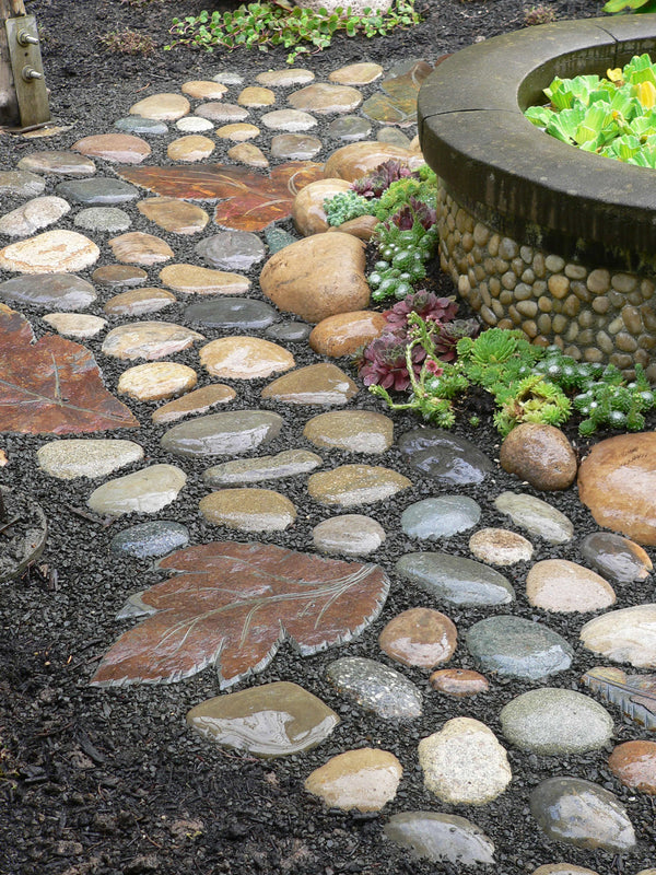 The Pecks build a cobblestone path. Marcia Westcott Peck / The Oregonian