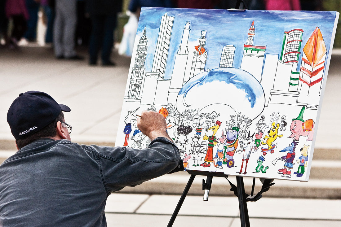 An artist painting the scene at the Bean at Millennium Park in Chicago. Kelly Johnson