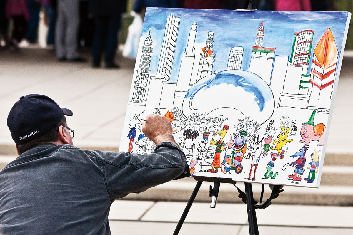 An artist painting the scene at the Bean at Millennium Park in Chicago. Kelly Johnson