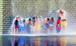 Enjoying a respite from the heat at the Crown Fountain in Millennium Park. PHOTO: KEN ILIO