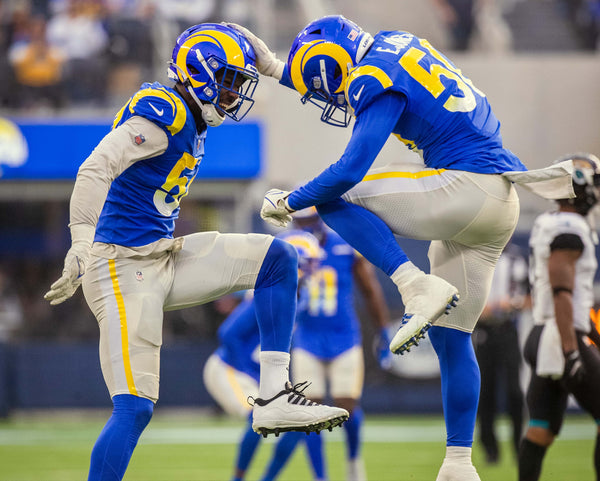 Los Angeles Rams inside linebacker Ernest Jones (50), right, celebrates with Los Angeles Rams outside linebacker Leonard Floyd (54) after teaming up on a 2nd quarter sack of Jacksonville Jaguars quarterback Trevor Lawrence (16) as Los Angeles Rams play the Jacksonville Jaguars at SoFi Stadium on Sunday, Dec. 5, 2021 in Inglewood, CA. Brian van der Brug/Los Angeles Times