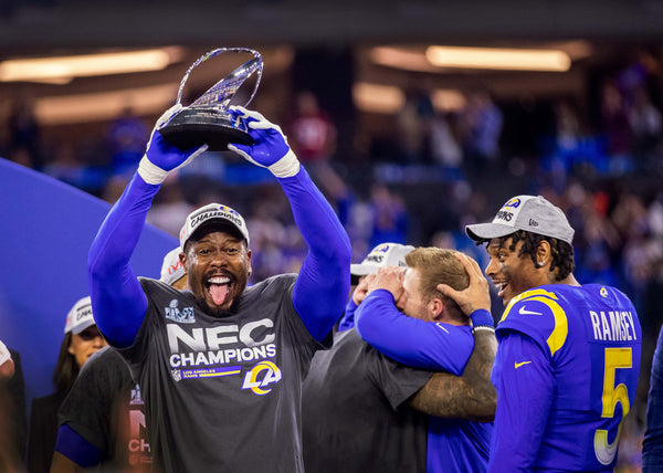 Rams line backer Von Miller hoists the NFC Championship trophy after the Rams 20-17 victory over the San Francisco 49ers in the NFC Championships at SoFi Stadium on Sunday, Jan. 30, 2022 in Los Angeles, CA. Allen J. Schaben / Los Angeles Times