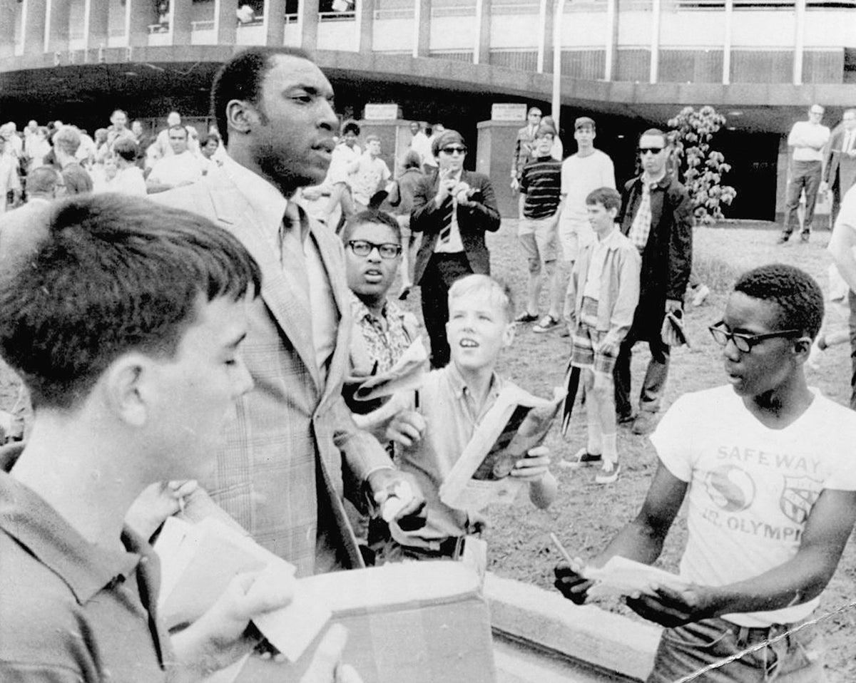 Children swarming "Wondrous" Warren McVea to ask for an autograph, circa 1969. Courtesy Denton Public Library