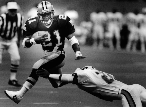 New Orleans Saints football player Dalton Hilliard runs past a Tampa Bay defender, 1988. Ted Jackson / NOLA.com | The Times-Picayune