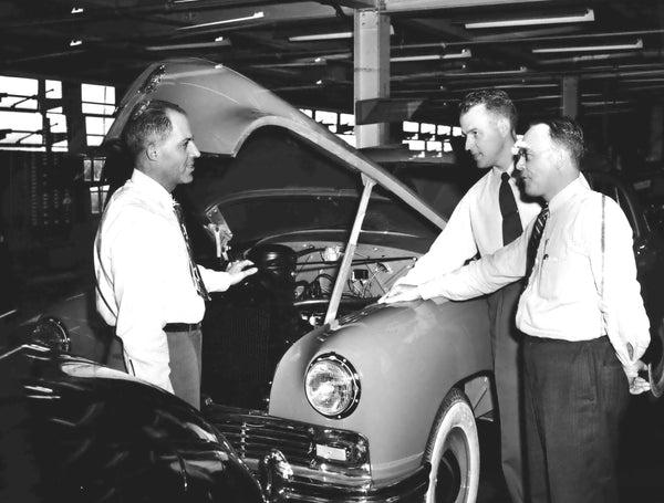 Former Vancouver shipyard officials who now oversee final touches in Kaiser-Fraser cars.  They are Howard Denhart, superintendent of chassis and car assembly, at left; Nils Eklund, his assistant, and Kenneth Hunter, superintendent of trim. Courtesy The Oregonian