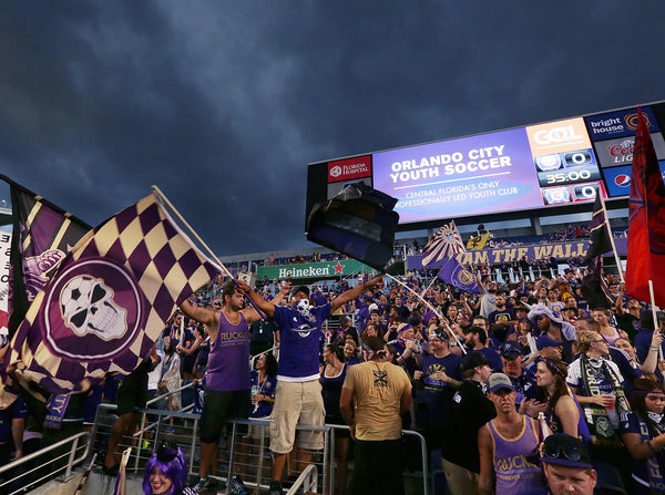 Dark clouds loom over the Citrus Bowl before Orlando City’s game against the Chicago Fire. Rough weather and rough play on the pitch don’t diminish fan support, though. Stephen M. Dowell / Orlando Sentinel