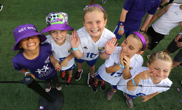 Young fans from the Winter Haven Kicks soccer club wait for the start of the Orlando City-Sporting Kansas City match at the Citrus Bowl. Joe Burbank / Orlando Sentinel