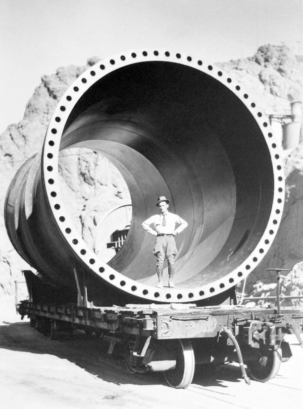 A man stands inside a 13-foot-diameter pipe at the Boulder Dam construction site, circa 1930. Courtesy Manis Collection, UNLV University Libraries Special Collections & Archives