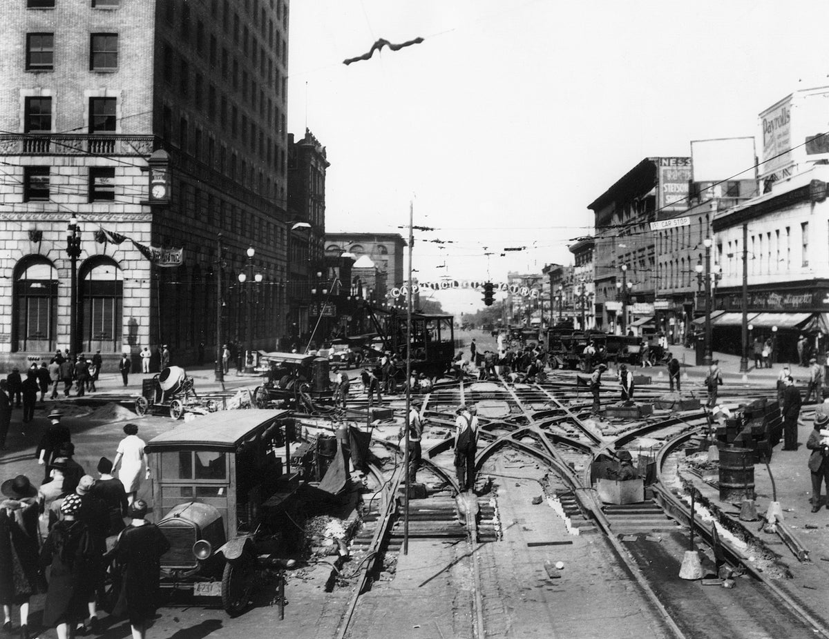 Workers remove trolley lines on Main Street in Salt Lake City in 1928. The Salt Lake Tribune
