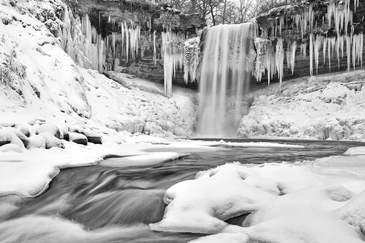 The fresh snowfall created a beautiful tranquil setting on the partially frozen landscape, combined with the power of the still flowing water made for a rare winter scene. It was magical! Photograph by Justin Pruden