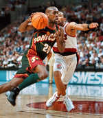 Gary Payton drives past Damon Stoudamire in the first half. The Oregonian
