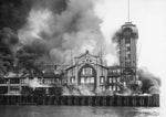 A fire destroys the Grand Trunk Pacific Dock on July 30, 1914 and five people were killed. The dock at the foot of Marion Street was the largest wooden pier on the West Coast at that time. Courtesy Seattle Public Library