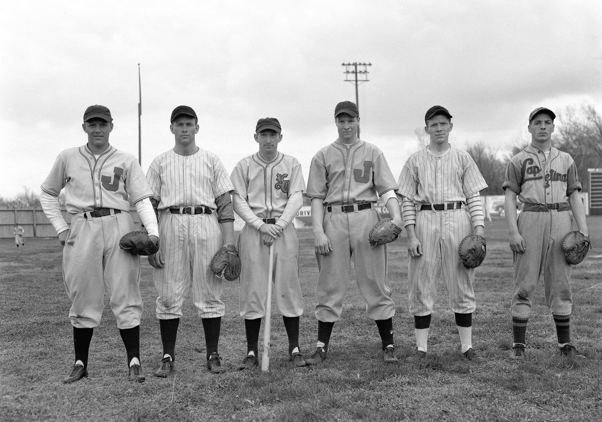 Six prospective catchers for the Joplin Miners baseball team pose during the spring of 1940. Left to right: Ralph Houk, Rex Twibell, Manager Paul “Red” O’ Malley, Harry “Bud” Heslet, Walter Gronek and Jimmy Griffin.