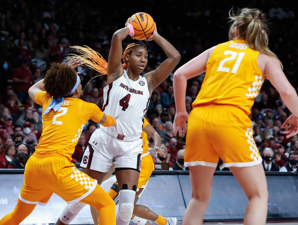 South Carolina’s Aliyah Boston (4) passes the ball as Tennessee’s Alexus Dye (2) and Tess Darby (21) pressure, Feb. 20, 2022. Tracy Glantz / The State