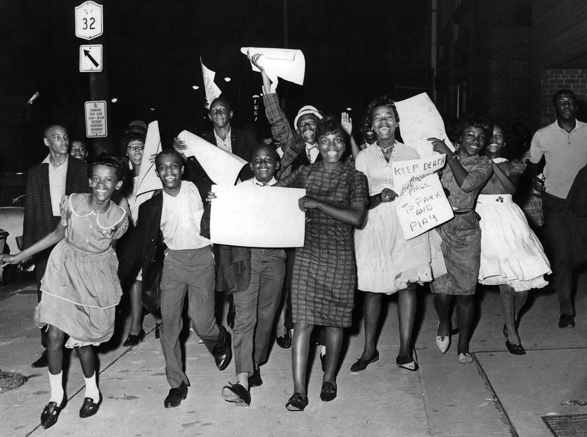 Young demonstrators marching up North Pearl Street in Albany, August 12, 1961. When a new proposed parking lot shut down their playground, local children and teenagers took to the streets. Several days of protesting culminated in a visit to Mayor Erastus Corning 2nd, and the demonstrators were successful in obtaining a new playground site in the Clinton Square neighborhood. Courtesy Times Union Historic Images