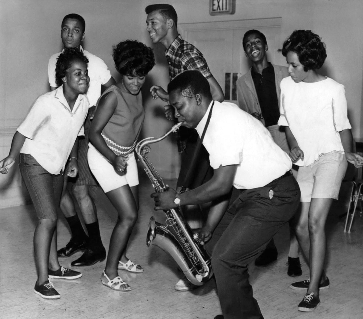 Saxophonist Nate Quattlebaum of the Sharp Chorde twisting away with party-goers on “Bermuda Night” at The First Reformed Church at North Pearl and Orange Streets, Albany, 1963. From left: Lillian Swigick, Charles Lownes, Marie Norwood, George Nobles, Alan Clow, Shirley Miller. The event was sponsored by the teenage council of the Clinton Square Neighborhood House. Courtesy Times Union Historic Images / Bob Richey